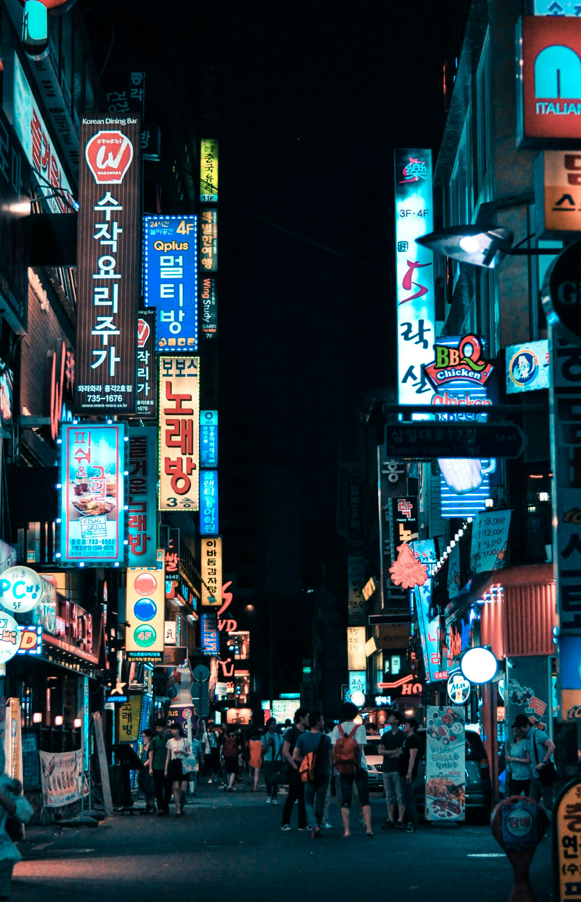 A cityscape of Seoul South Korea with neon lights illuminating the downtown area